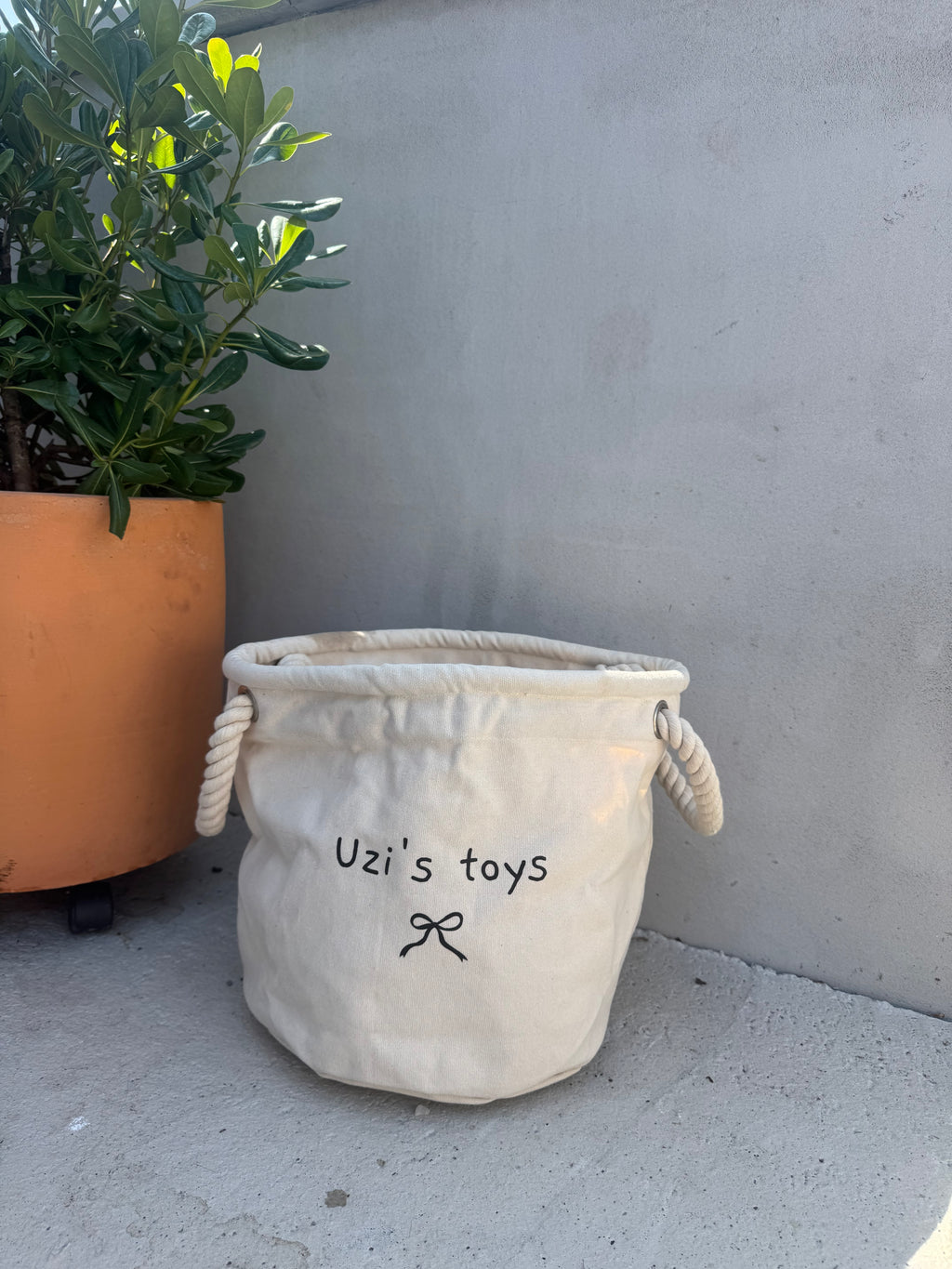 Panier à jouets personnalisable avec petit noeud